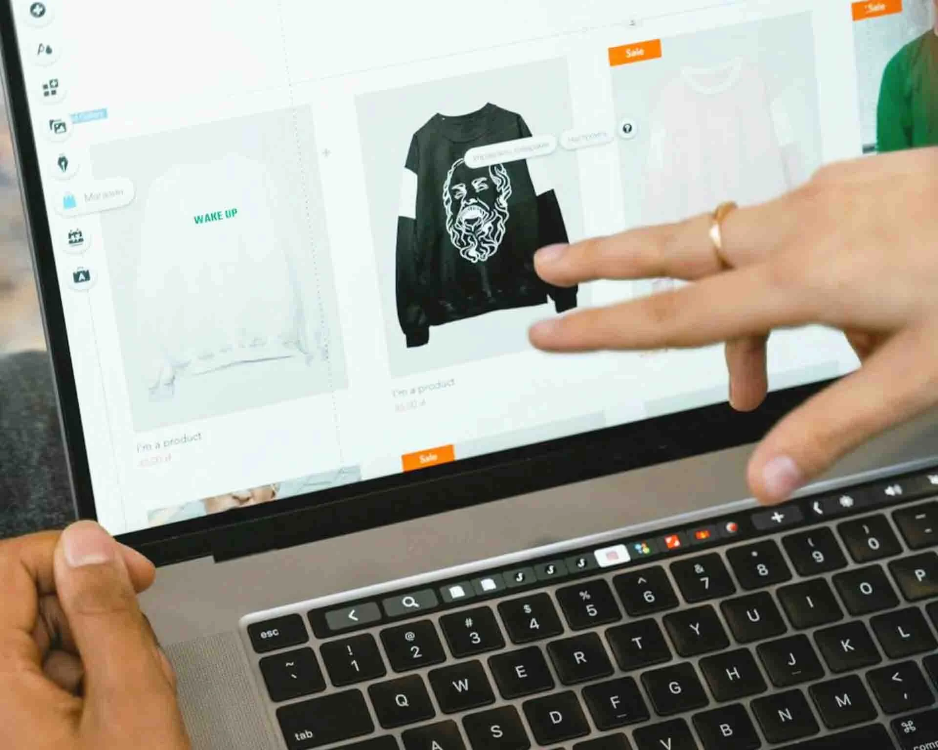 A laptop screen displaying a website-building program with some products for sale being changed