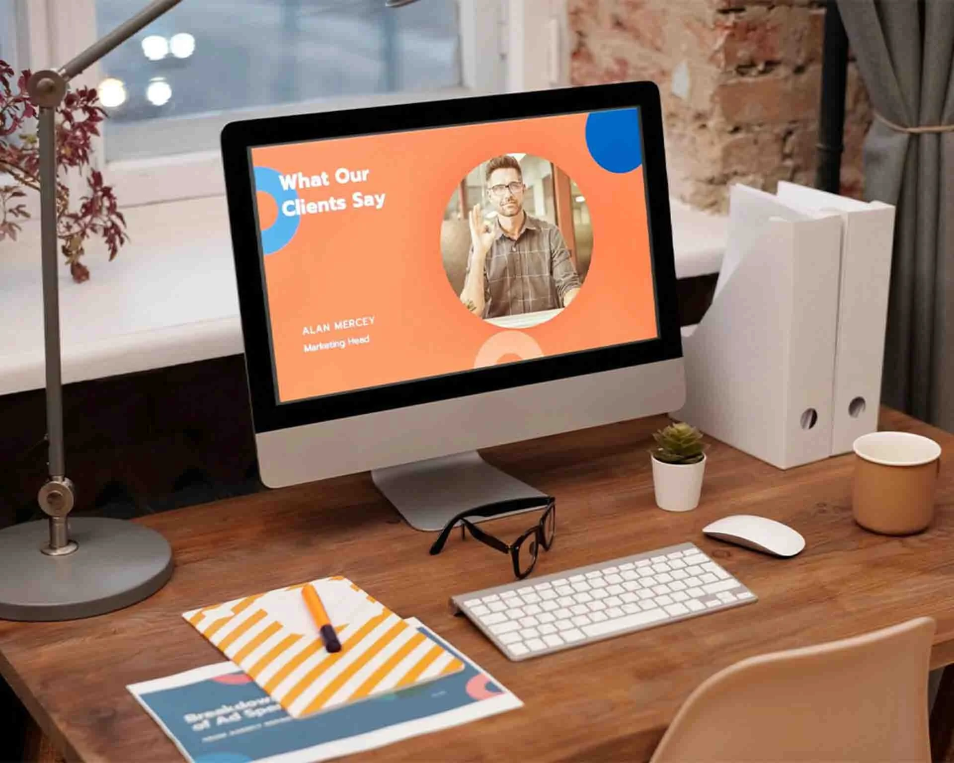 Desk with a computer monitor on top of it displaying a personal website on its screen